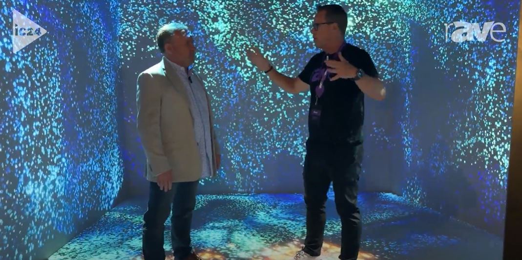 Video thumbnail: Two people standing in a room with colors being projected on the walls behind them