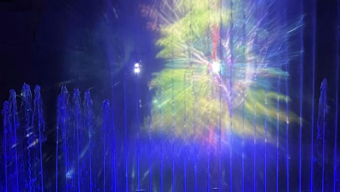 The show features live performers with large-scale projections on the mountain face (left) and water curtain projections (right) that mesmerize audiences. 