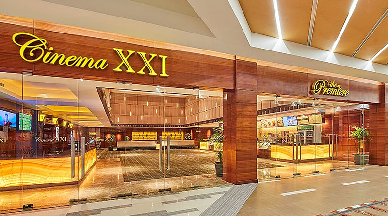 View through a front glass wall of the Cinema XXI lobby.