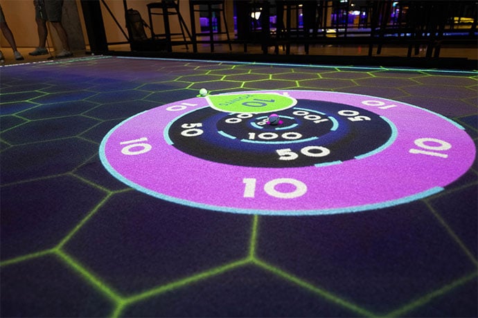 Artificial turf is illuminated with a bullseye.