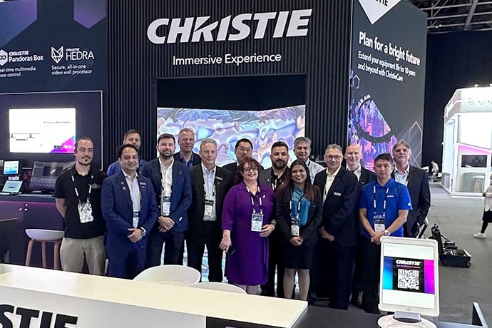 The Christie team in front of the Christie booth at Integrate Middle East 2024