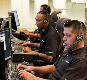 technical support team on computers with headsets